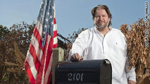 Author Rick Bragg in front of his home in May.