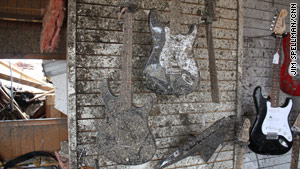 A wall of damaged guitars was all that was left of the Joplin music store after the devastating May 22 tornado.