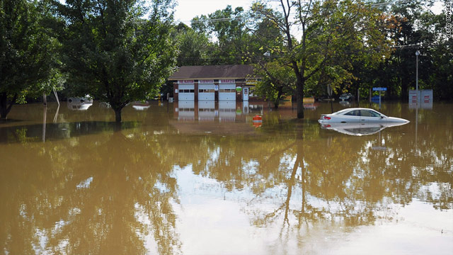 Rains and the cresting of nearby waters caused flooding in front of the Hi-Tech auto shop in Wayne, New Jersey.