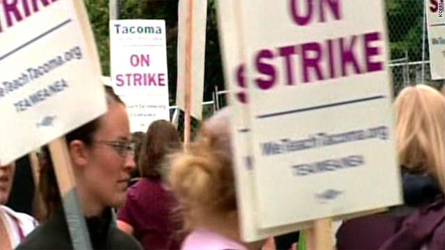 Striking teachers march on a picket line Wednesday in Tacoma, Washington.