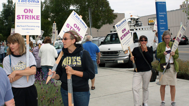 Striking teachers march on a picket line Wednesday in Tacoma, Washington.