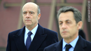 French President Nicolas Sarkozy, right, and defense minister Alain Juppe defended the actions of French soldiers.