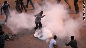 Tear gas surrounds protesters in Egypt. In Egypt and Tunisia, pictures of U.S.-made canisters have been posted online.