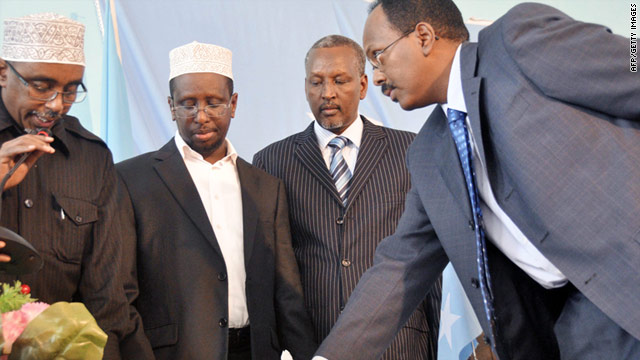 Mohamed Abdulahi Mohamed (right) is sworn in as Somalia's new prime minister in Mogadishu on November 1, 2010.