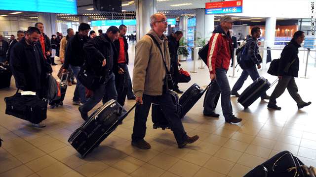 People arrive at Sofia airport, among them South Koreans, after being evacuated from Tripoli on February 23, 2011.