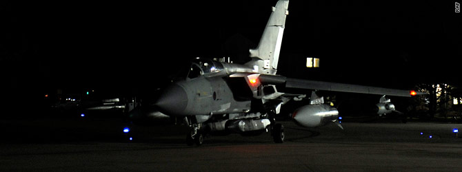 Gadhafi defiant as air strikes hammer Libyan targets