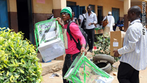 An official of the independent Nigerian electoral commission carries ballot boxes on April 2.