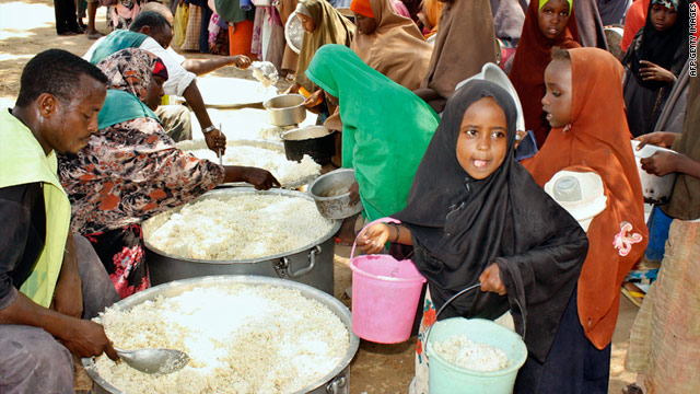 Photo on March 23, 2011, shows displaced Somali children receiving food-aid at a distribution centre in the wartorn capital, Mogadishu.