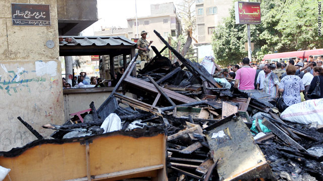 Christians remove objects from a burned church in the working-class neighborhood of Imbaba in Cairo on May 8.