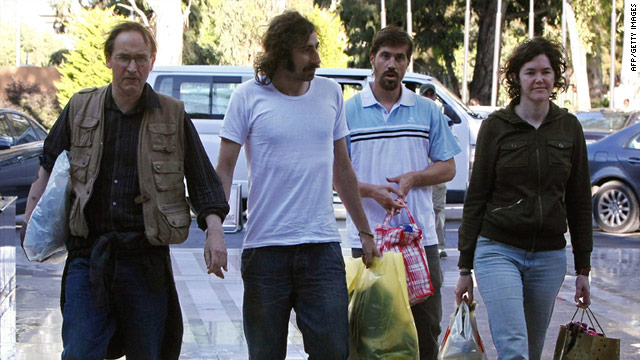 Nigel Chandler, from left, Manuel Varela, James Foley and Clare Morgana Gillis arrive at Rixos Hotel in Tripoli on Wednesday.