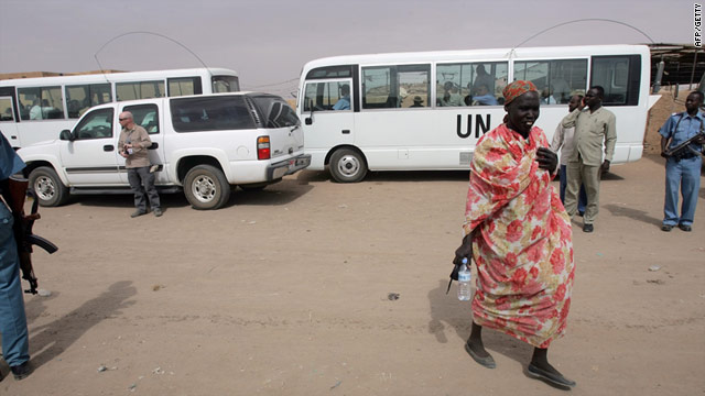 Armed guards stand next to U.N. vehicles at Mandela camp for displaced southern Sudanese, south of Khartoum.