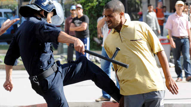 A police officer kicks a demonstrator during a protest in Rabat, Morocco, last week.