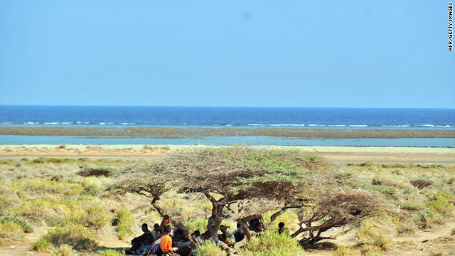 Ethiopian illegal immigrants wait on a beach for smugglers' boats to take them across the Gulf of Aden into Yemen.