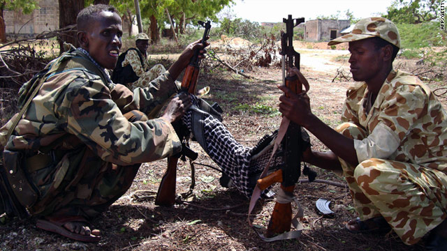 Somali government soldiers clean their weapons at southern Mogadishu?s Shirkole area on Thursday, June 2.