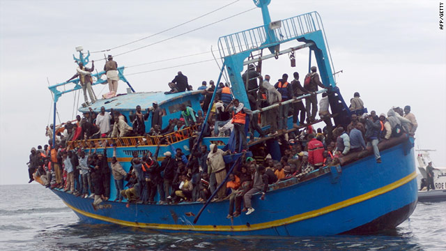 African migrants stranded on a boat coming from Libya wait for rescue services near Sfax, on the Tunisian coast, on June 4.