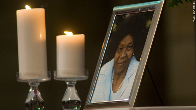 Two candles are placed next to a photograph of anti-apartheid activist Albertina Sisulu, who died on June 2, 2011.