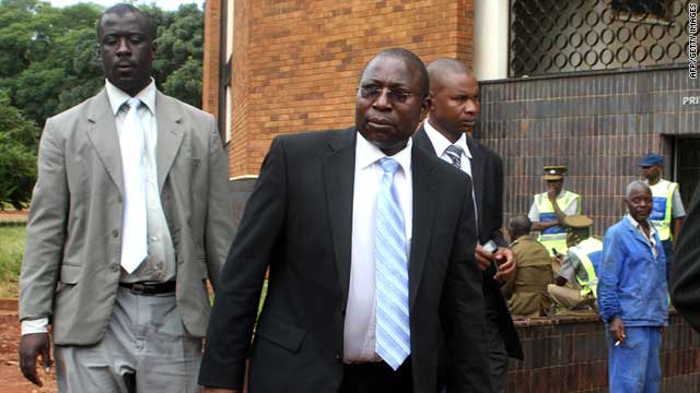Zimbabwe's Energy Minister Elton Mangoma (center) arrives at the Harare Magistrate's court on March 11, 2011.