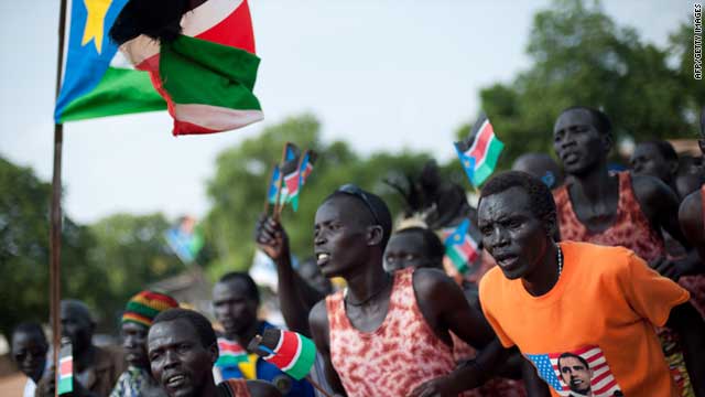 People dance and celebrate during a rally organised by the Sudan People's Liberation Movement in Juba on July 5, 2011.