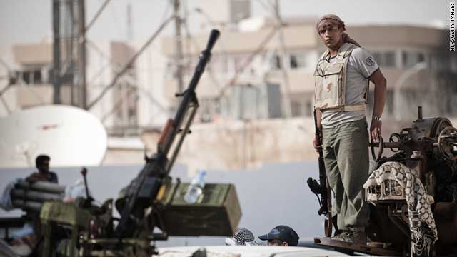 A Libyan rebel prepares to drive towards the Brega frontline from Ajdabiya on July 14, 2011.