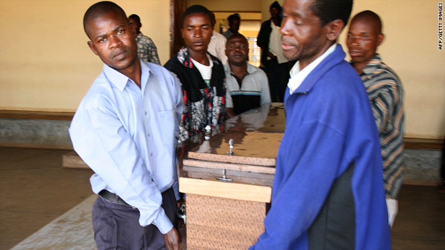 Men carry the coffin of a protester shot dead during demonstrations in Lilongwe, Malawi on July 22.  (Photo Courtesy of CNN.)