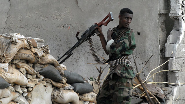 A Somali government soldier mans a position inside Mogadishu's Bakara market Monday.