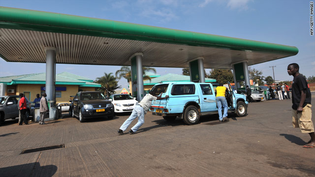 Malawians wait for fuel at a petrol station in Lilongwe, on July 14, 2011.