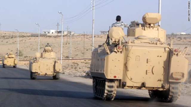 A convoy of Egyptian armoured vehicles head along a road on the Sinai Peninsula near the Gaza border on August 13, 2011