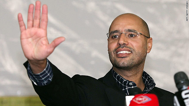 Saif al-Islam Gadhafi, one of three sons of Moammar Gadhafi reportedly captured by Libyan rebels, waves to a crowd in March.  