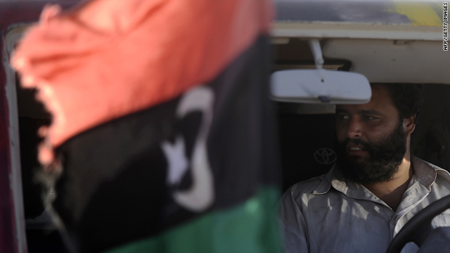 A Lilbyan rebel sits in his military vehicle at an advanced military position near Al-Sadaadi between Misrata and Sirte Wednesday.