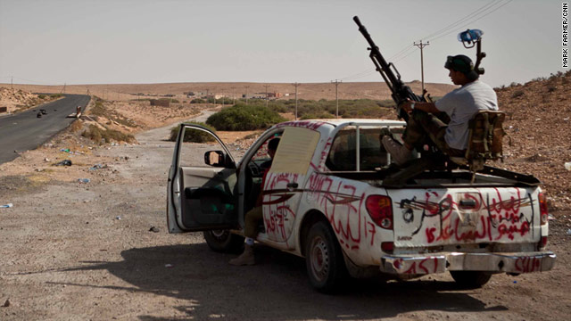 Libyan fighters from the National Transitional Council outside the Gadhafi loyalist town of Bani Walid on September 06, 2011.