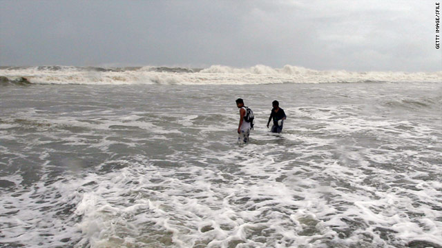 Two youngsters enjoy the beach in Acapulco on August 24, 2010.