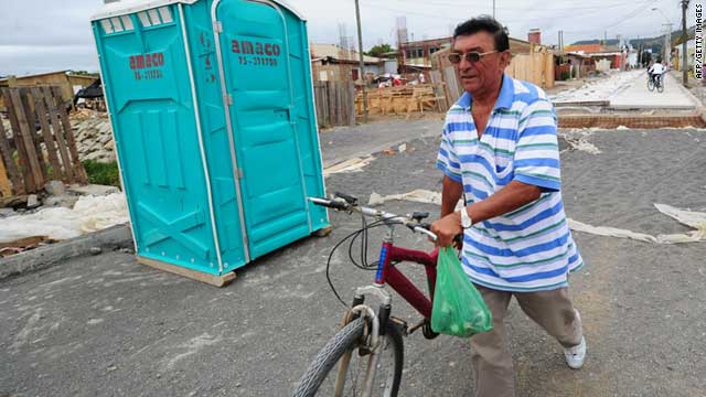 A local resident hurries to abandon the waterfront after an earthquake in Constitucion, Chile, south of Santiago, on Friday.