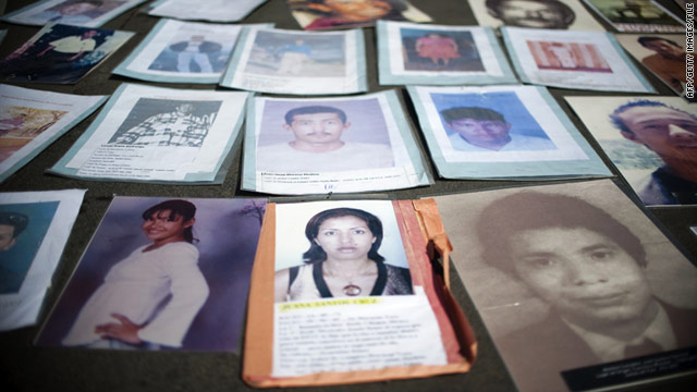 Loved ones of Honduran migrants missing in Mexico laid out their photos in a demonstration in Mexico City last November.
