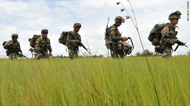 Soldiers patrol an area in eastern Colombia where FARC rebels allegedly kidnapped 22 oil contractors in early March.