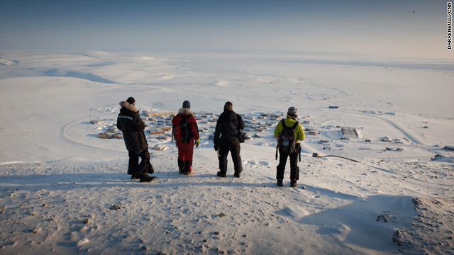 The team stands above Resolute Bay in the Canadian Arctic.