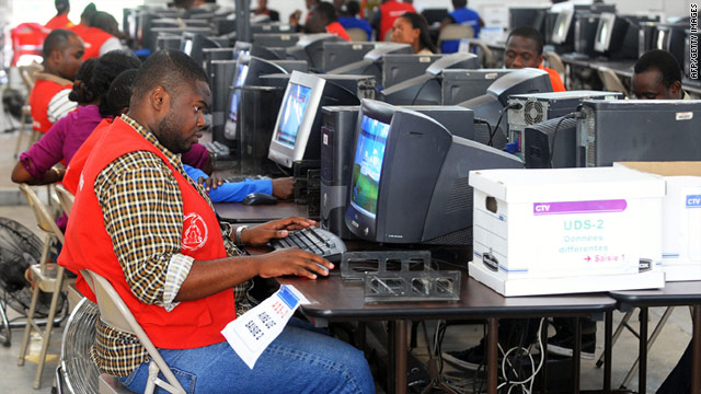 Haitian electoral workers count votes Friday. Final votes for a highly anticipated runoff are not expected until April 16