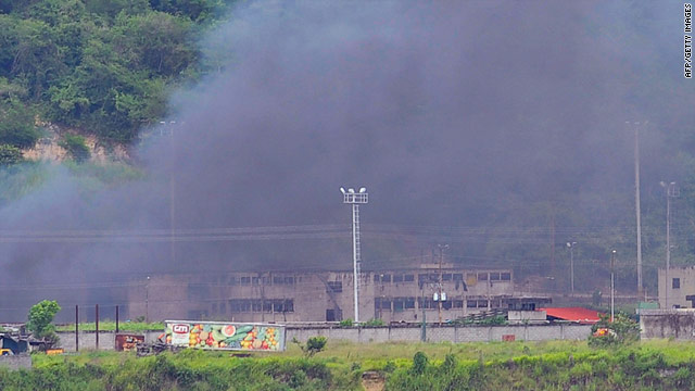 Smoke billows from the Rodeo I prison near Caracas, Venezuela, on June 17.