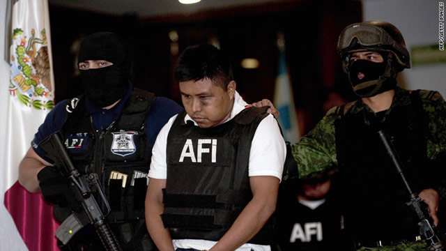 Alleged member of Los Zetas drug cartel Abraham Barrios Caporal, aka 'El Erasmo', is presented to the press in Mexico City, on June 30.