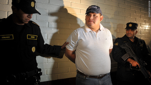 Police escort Elgin Enrique Vargas Hernandez, 35, on Tuesday. Authorities say he was the crime's mastermind.