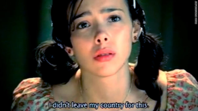 A TV ad shows a girl trapped in a large cage, being forced to sing by her captors.
