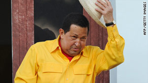 Venezuelan President Hugo Chavez salutes from a balcony of  in Caracas last month.