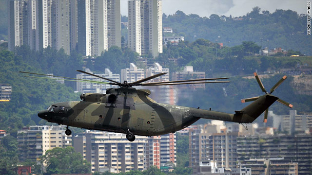 http://i.cdn.turner.com/cnn/2011/WORLD/americas/08/18/venezuela.plane.crash/t1larg.venezuela.helicopter.jpg