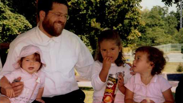 Jacob Ostreicher, seen with three of his 10 grandchildren, hopes to be home in New York for Rosh Hashanah later this month