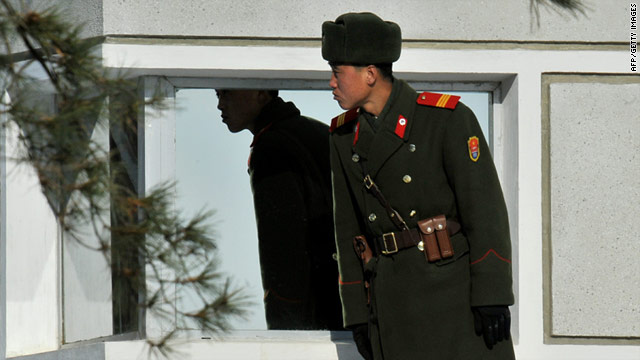 A North Korean soldier stands guard in the Demilitarized Zone separating the two Koreas on January 19, 2011.