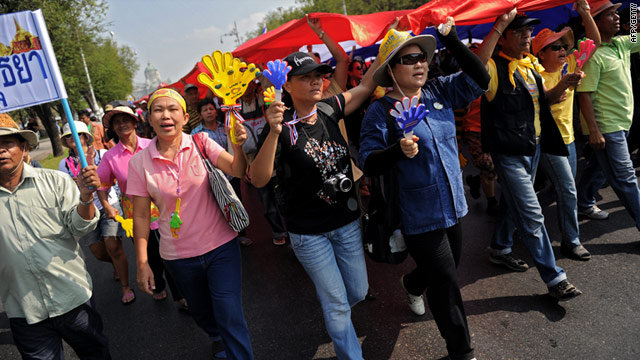 Crowds of hundreds of yellow-shirted protesters shouted "get out Abhisit" as they marched through Bangkok on Friday.