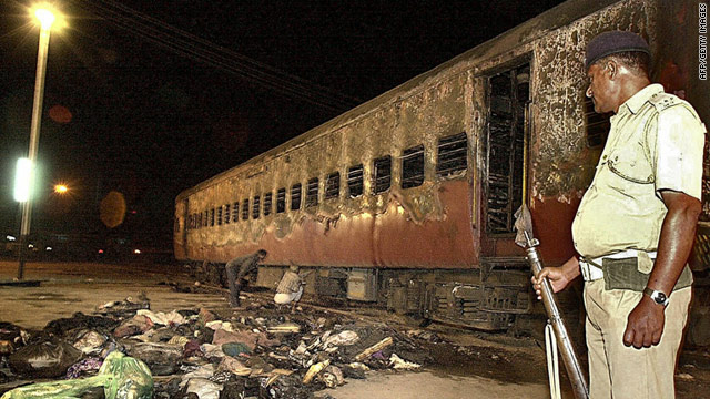 A file picture from February 28, 2002, showing the burnt out train coach. The arson attack sparked widespread riots.