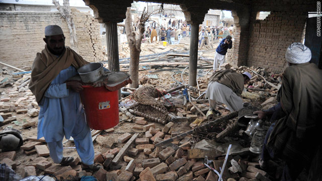 Pakistanis searched for belongings in their damaged houses following a suicide car bomb attack near Hangu on Thursday.