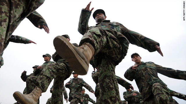 Afghan National Army non commissioned officers march during a graduation ceremony in Kabul on February 3, 2011.