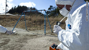 Greenpeace members monitor radiation in Iitate on Sunday, 40 kilometers from the damaged Fukushima Daiichi plant.