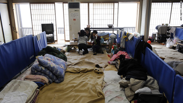 A family group from Fukushima at a makeshift shelter in Yokote city, Akita prefecture.